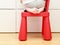 Child feet on baby chair, kids home safety concept