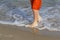 Child feet on beach