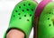 Child feet with green Rubber shoe