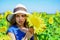 child in field of yellow flowers. teen girl in sunflower field. concept of summer vacation. rich harvest and agriculture