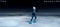 child  figure skater on dark ice arena background