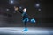 Child  figure skater on dark ice arena background