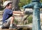 Child filling water bottle