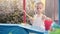 Child Fisher Catching Plastic Toy Fish On Pool Amusement Park Summer Day