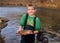 Child fishing - holding a Rainbow Trout