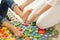 Child flatfoot treatment using special massage carpet.Little girl on massage mat doing exercises for flatfoot prevention