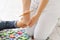 Child flatfoot treatment using special massage carpet.Little girl on massage mat doing exercises for flatfoot prevention