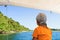 Child floats on a catamaran on the picturesque Lake