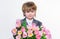 Child with flowers. Little boy with bouquet of tulips. Gift to mother. Birthday, Womens Day, Mothers Day, Valentines day.