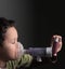 Child with flu with inhaler respiratory puff on grey background stock photo