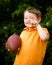 Child with football celebrating