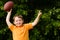 Child with football celebrating