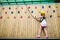 Child in forest adventure park. Kids climb on high rope trail. Agility and climbing outdoor amusement center for children. Little