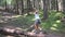 Child in forest walking tree log kid playing camping adventure girl outdoor wood