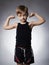 Child. Funny Little Boy.Sport Handsome Boy showing his hand biceps muscles