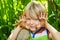 Child in garden with dirty hands