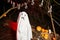 Child in ghost costume at party