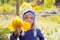 Child girl in autumn poplar forest yellow fall leaves in hand