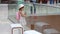 Child girl with a backpack and a hat in the waiting hall. Little tourist at the airport before the flight and travel