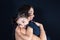 Child girl daughter hug in love mother arms shoulder in black background