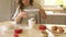 child girl decorating cake in a mug, baking at home with kids, dessert preparation