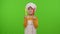 Child girl dressed chef cook with fork and knife, waving head approval on chroma key background