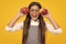 Child girl eating an apple over isolated yellow background. Tennager with fruit. Happy girl face, positive and smiling