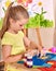 Child girl glue in preschool