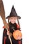 Child girl Halloween witch with pumpkin, broom.