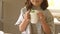 child girl holding cake in a mug, baking at home with kids, dessert preparation