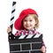 Child girl holding clapper board in hands isolated