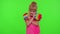 Child girl holding many colorful squishy silicone bubbles pop it popular sensory toys, thumb up