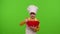 Child girl kid dressed as cook baker chef mix dough in bowl, prepare cake on chroma key background