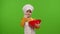 Child girl kid dressed as cook baker chef mix dough in bowl, prepare cake on chroma key background