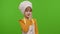 Child girl kid dressed as cook chef holding finger on her lips on chroma key, gesture hush, secret