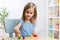 Child girl kid playing with sorter toys in nursery