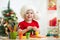 Child girl making by hands christmas decorations