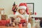 Child girl preparing gifts for christmas at home, cozy holiday interior