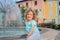 Child girl relaxing at fountain in Izola (Isola) city in Slovenia.
