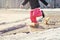 Child girl running in spring puddle with big splash