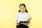 Child girl school uniform clothes hold book and pen. Girl cute write down idea notes. Notes to remember. Write essay or