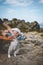 Child girl walking on moss outdoor with father family travel in Norway