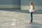 Child girl wrote on the asphalt. I love my planet. Eats an apple and looks at the text, healthy lifestyle, healthy eating