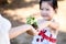 Child giving plant seedling