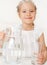 Child with glass pitcher water