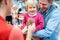 Child grabbing some sweets out of a jar in the candy store