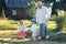 Child and grandfather rural field