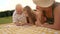 Child and grandparents drawing outdoors.