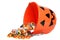 Child halloween pumpkin bucket spilling candy