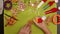 Child hand decorates gingerbread christmas cookie